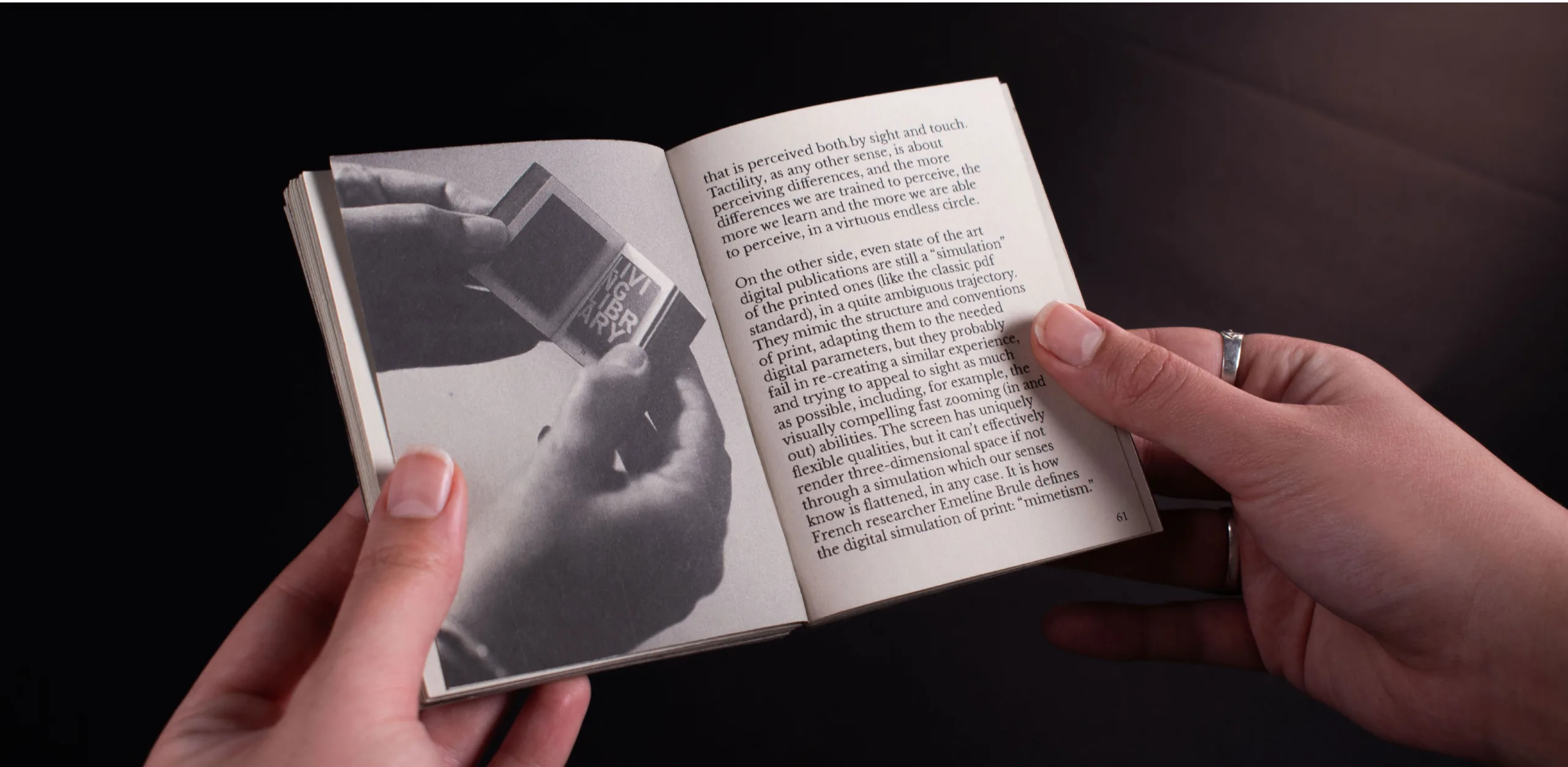 A Sense of Reality, a palm-sized publication, held open