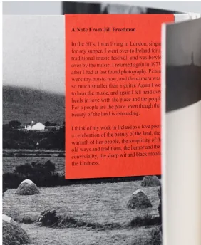 Abbey Reel Pt1 photo book, open at a spread with a red note pinned over a black and white Irish landscape